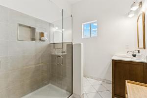 a bathroom with a shower and a sink at Relaxing Casita - Pool - Spa - Prime Location in Phoenix +17 photos