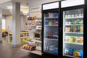 a refrigerator filled with lots of food and drinks at Spark By Hilton Guelph in Guelph