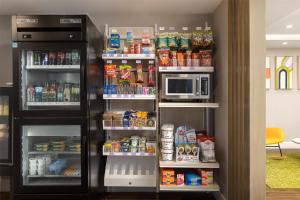 a refrigerator filled with lots of food and drinks at Spark By Hilton Woodstock in Woodstock