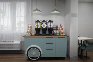 a cart with boots on top of it in a room at Spark by Hilton Miami Doral in Miami