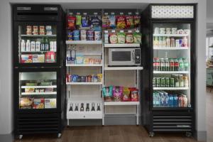 a refrigerator filled with lots of food and a microwave at Spark by Hilton Miami Doral in Miami +27 photos