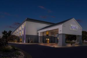 a large building with a sign on the side of it at Spark By Hilton Stevensville in Stevensville