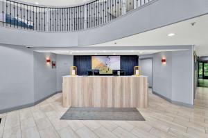 a lobby with a reception desk in a building at Spark by Hilton Plymouth in Plymouth +67 photos