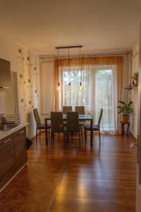 a kitchen and dining room with a table and chairs at Apartmán Česká Metuje in Česká Metuje