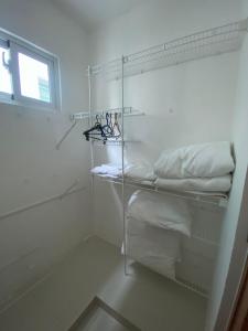 Ένα ή περισσότερα κρεβάτια σε δωμάτιο στο Hermoso alojamiento en Santo Domingo