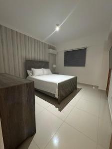 Ένα ή περισσότερα κρεβάτια σε δωμάτιο στο Hermoso alojamiento en Santo Domingo