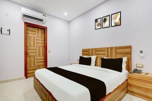 Ένα ή περισσότερα κρεβάτια σε δωμάτιο στο Hotel O Galaxy Inn