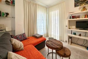 a living room with a couch and a table at Apartment La Perla, Los Cristianos in Los Cristianos