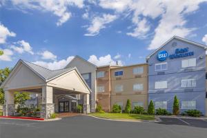 a hotel with a best western sign in a parking lot at Best Western Independence Kansas City in Independence