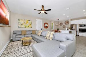 a living room with a couch and a ceiling fan at Inviting Home Near Disney With Waterpark & Resort Access At Encore Resort - 7792Sw in Kissimmee