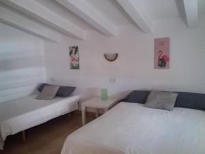 Postel nebo postele na pokoji v ubytování Casa acogedora en la playa