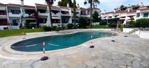 a large swimming pool in front of a building at Siviri Serenity, 3 minutes walk from the Beach in Siviri