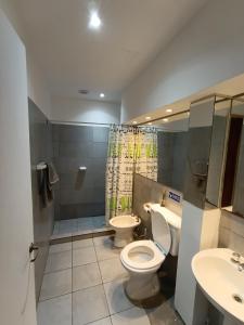 a bathroom with two toilets and a sink at Departamento La Morenita in Chilecito