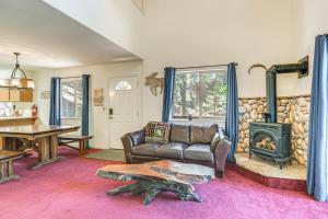 a living room with a couch and a wood stove at Hike, Swim, Golf Family Retreat in Arnold! in Arnold