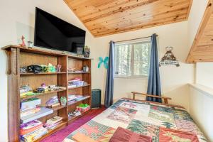 a bedroom with a bed and a flat screen tv at Hike, Swim, Golf Family Retreat in Arnold! in Arnold