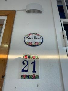 a white boat with a sign on the side of it at Rocco s Vivienda in Scalea