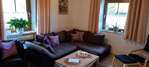 a living room with a couch and a table at Fewo Steinbeisser in Arrach