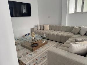 a living room with a couch and a coffee table at Marshall property in Tangier