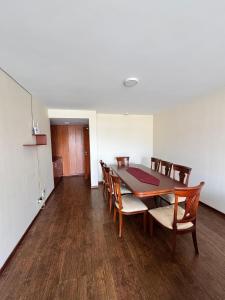 a dining room with a table and chairs at Lovely 3-bedroom Apt near the Centro de Cuenca in Cuenca +13 photos