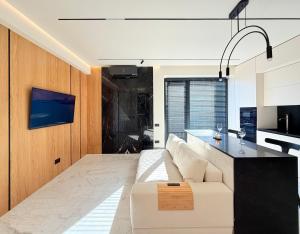 Μια τηλεόραση ή/και κέντρο ψυχαγωγίας στο Urban Elegance Apartment