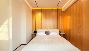 Ένα ή περισσότερα κρεβάτια σε δωμάτιο στο Urban Elegance Apartment