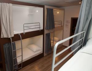 Posteľ alebo postele v izbe v ubytovaní En Route Hostel
