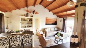a living room with a table and a couch at chalet 275 in Rendeux
