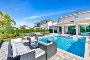 The swimming pool at or close to Lavish Home Near Disney With Media, Game & Theme Rooms With Waterpark & Resort Access At Encore Resorts Reunion - 520Bu