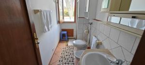 a small bathroom with a toilet and a sink at Villa Calatafimi Segesta in Calatafimi +33 photos