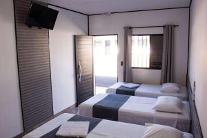 Postel nebo postele na pokoji v ubytování Hotel Rosim