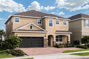 a large house with a driveway at Gorgeous Home With Media, Disney Themed Kids Room Near Disney With Waterpark & Resort Access At Encore Resort - 771La in Kissimmee +18 photos