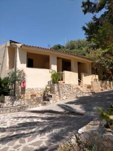 a house on the side of a road at Villaggio Athragon in Capo Vaticano
