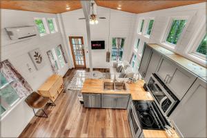 an aerial view of a kitchen and living room of a tiny house at Dogwood Cottage with Private Fire Pit & Sleeps 6 in Menlo