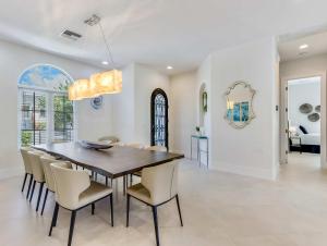 a dining room with a table and chairs at Casa Captiva - Deluxe 5 Bedroom Villa Steps to Beach in Captiva +45 photos