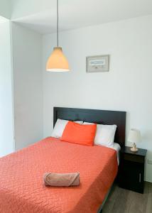 Giường trong phòng chung tại Narama 2 - Airport apartment - Guatemala City