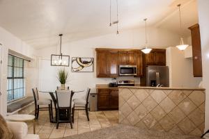a kitchen and dining room with a table and chairs at The Cooper Nest in Garland