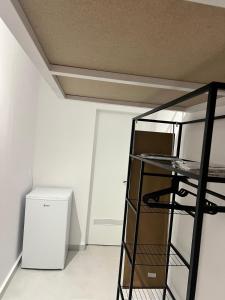 a room with a glass shelf and a refrigerator at Casa Paraíso in Adeje +6 photos