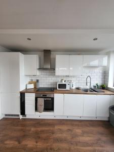Kuchyň nebo kuchyňský kout v ubytování Penthouse Nottingham Apartment