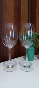 two wine glasses sitting on top of a table at Morada das Mandalas in Pomerode