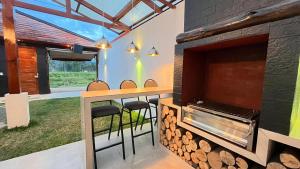 a bar with a fireplace in a house at C4s4 RANCH OXAPAMPA in Oxapampa