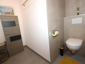 a small bathroom with a toilet and a sink at Apartment Katharina in Steinach am Brenner +20 photos