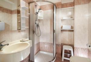 a bathroom with a shower and a sink and a toilet at Hotel Alba Serena in Misano Adriatico +10 photos