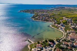 an aerial view of a small island in the water at Seaside luxury villa with a swimming pool Privlaka, Zadar - 18508 in Privlaka