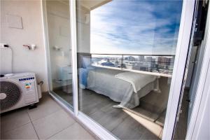 a room with a balcony with a bed on a ship at La Florida Mirador Azul 2 in Santiago +33 photos