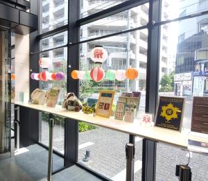 a window display of books on a shelf in a store at Tokyu Stay Kamata - Tokyo Haneda in Tokyo