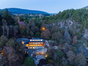 an aerial view of a building in the woods at Paraíso Casa de Montaña in San Martín de los Andes