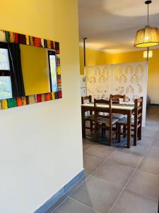 a dining room with a table and chairs at Patta Tickan in El Peñón +12 photos
