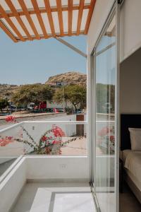 a room with a view of a balcony at Zorritos beach house in Zorritos