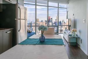 a kitchen with a table with a view of a city at Urban Skyline in Toronto