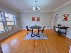 a dining room with a table and chairs at Charming 1BR Apt in Evanston - Hinman B3 in Evanston +17 photos